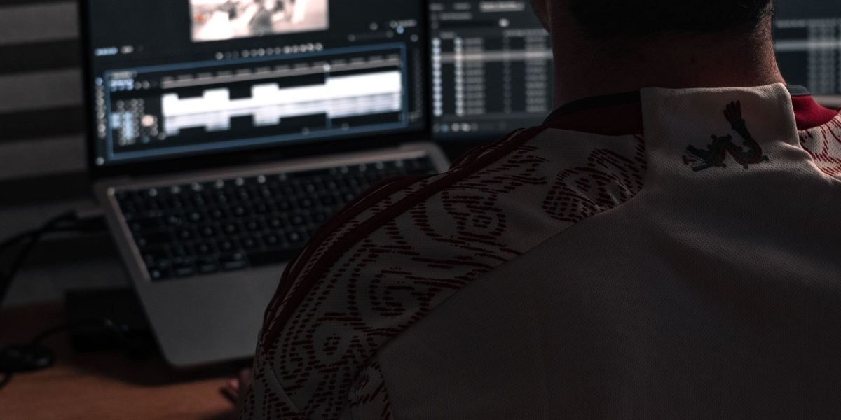 Editor preparing an AI news story on a laptop