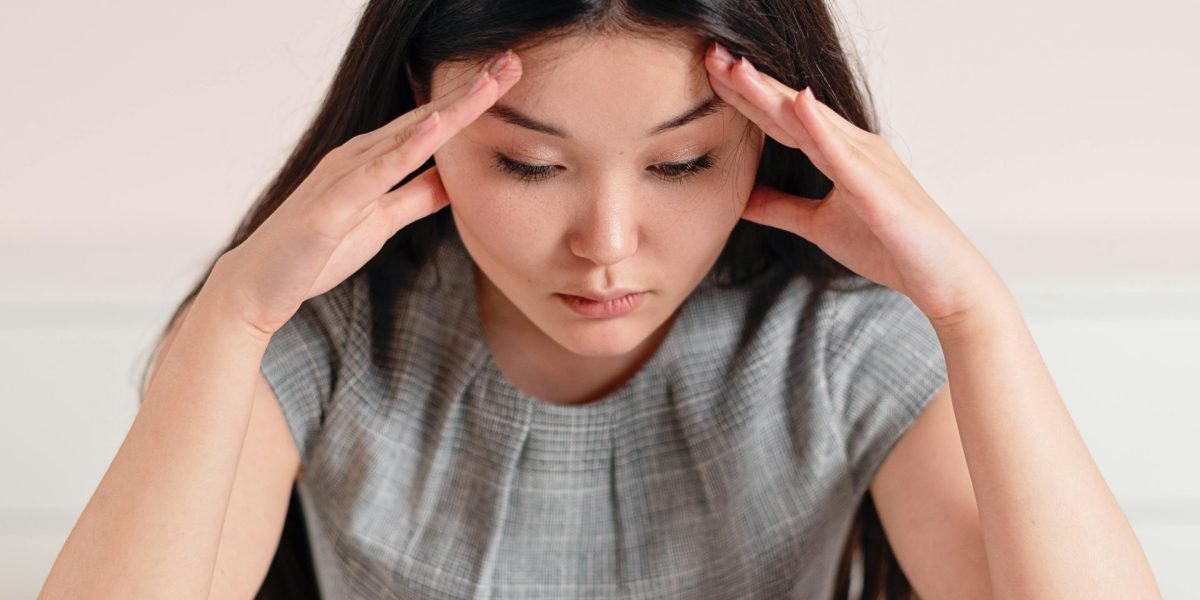 A person contemplating numerous career path options, seeking clarity amidst choices.