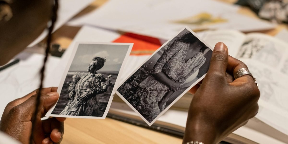 A creator or business owner smiling, happy with the quality of enhanced images.