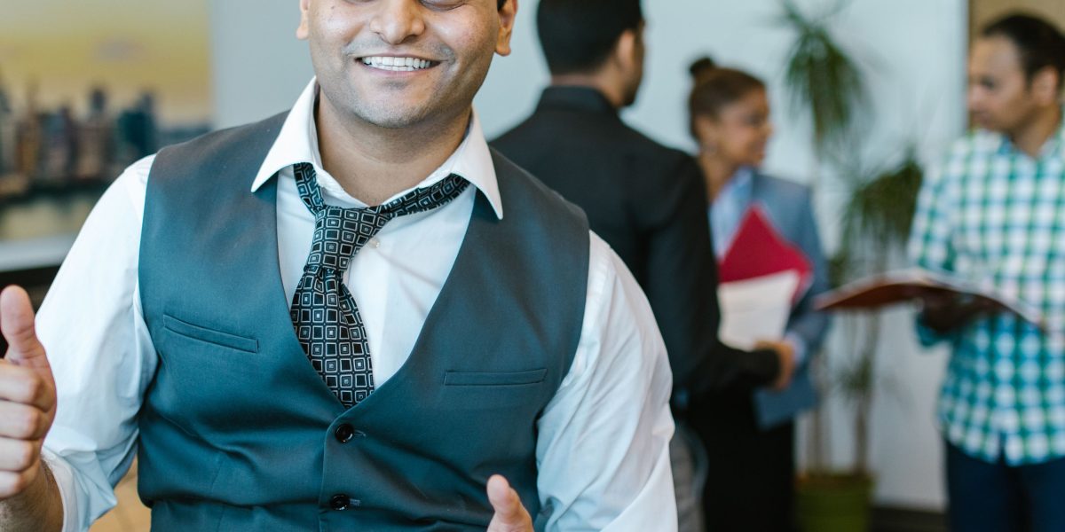 A confident professional smiling, indicating successful decision-making or positive outcomes in their AI journey.