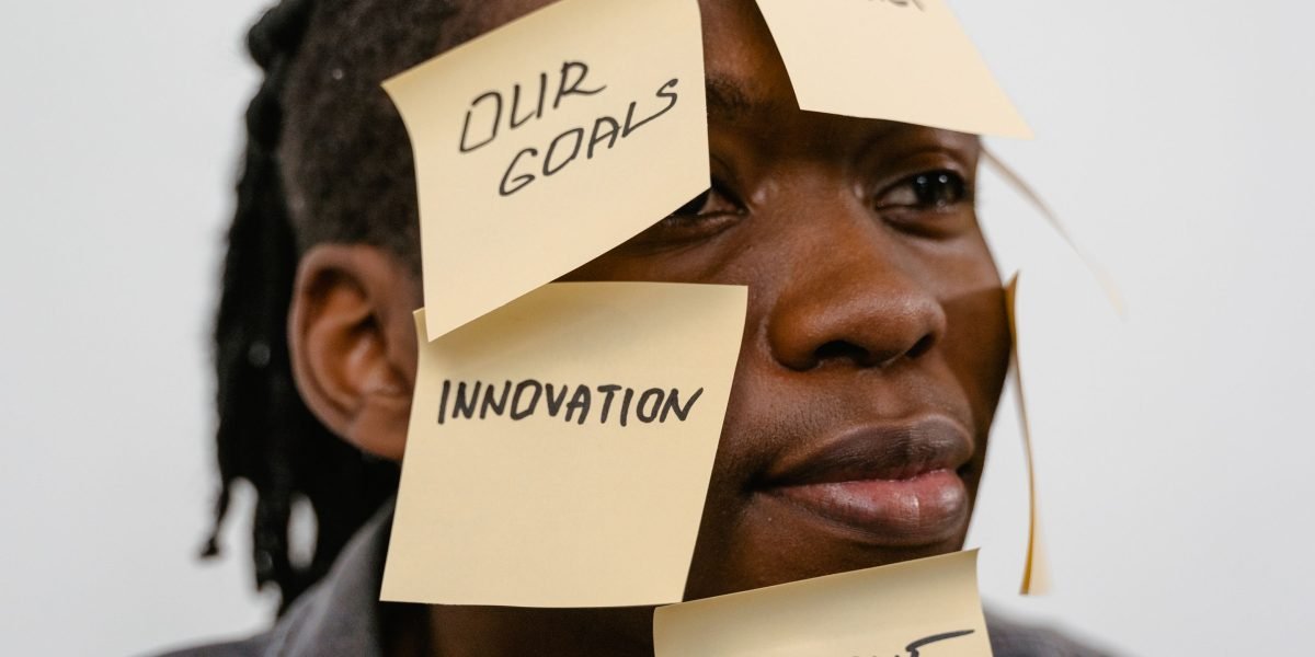 A person contemplates complex data, representing the challenge of forming a clear AI strategy.
