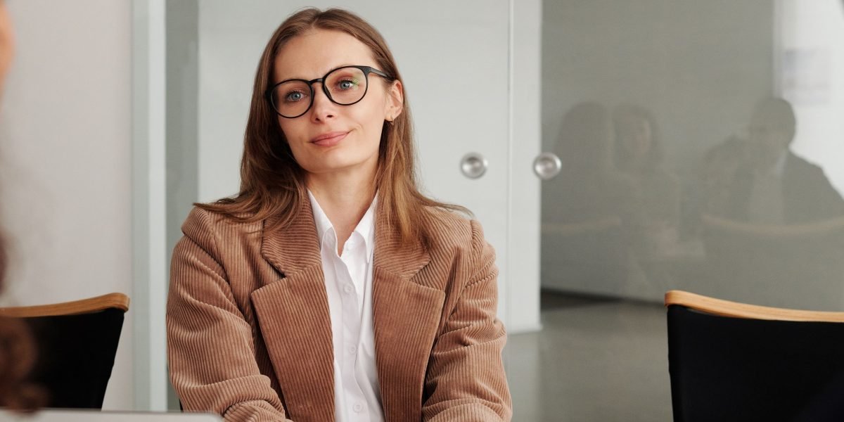 A confident person participating in a job interview, representing the successful transition from learning to a professional role.