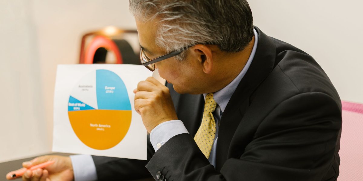 A business professional reviewing key marketing metrics to ensure a positive return on investment.