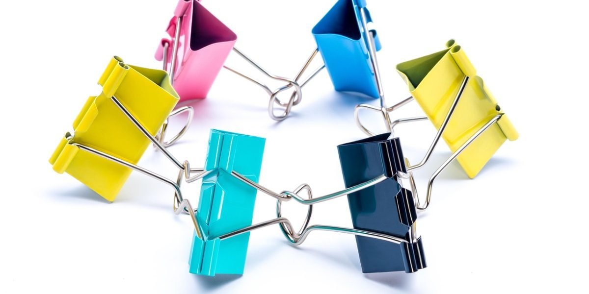 A team of creative professionals collaborates in an office setting, illustrating the seamless integration of AI tools like Adobe Firefly into existing workflows.