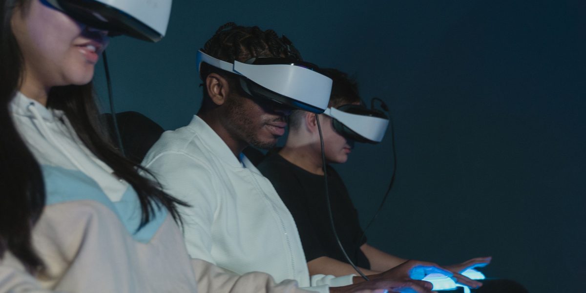 Individuals engaging with immersive technology, demonstrating spatial computing applications in a professional context.