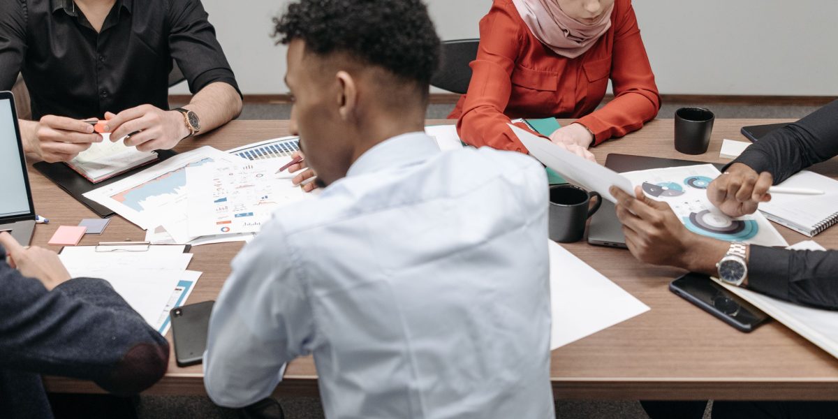 A diverse group of professionals working together, highlighting the importance of varied perspectives in data.