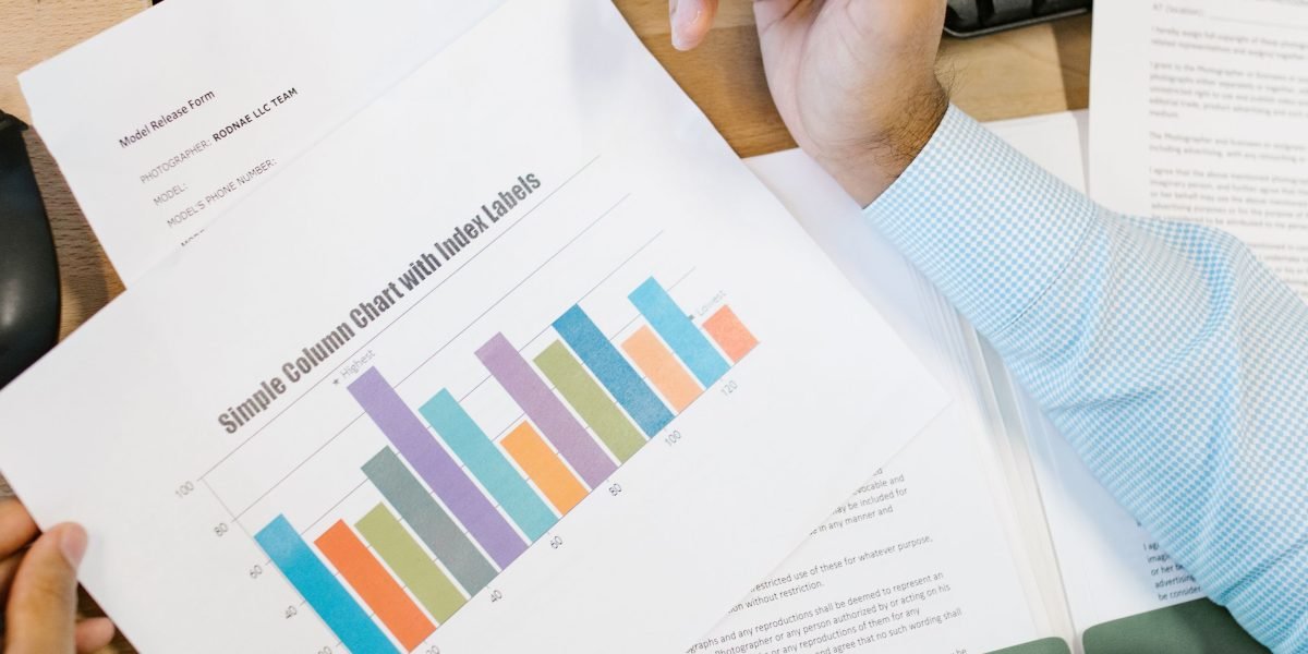 A person diligently analyzing financial reports related to AI platform costs and potential ROI.