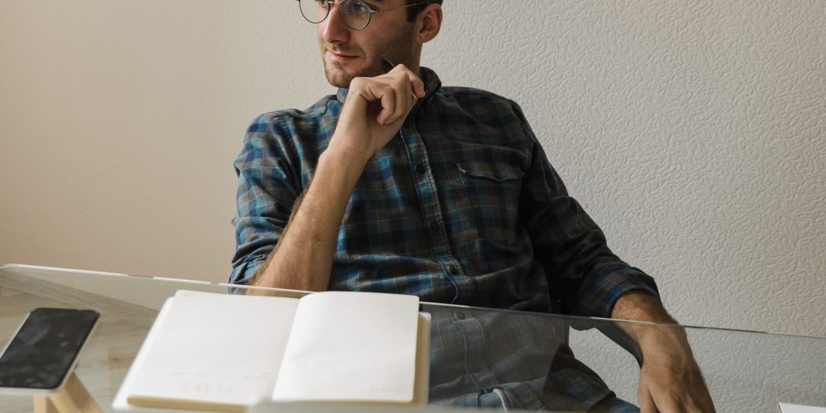 A content creator or small business owner contemplating their video creation options.