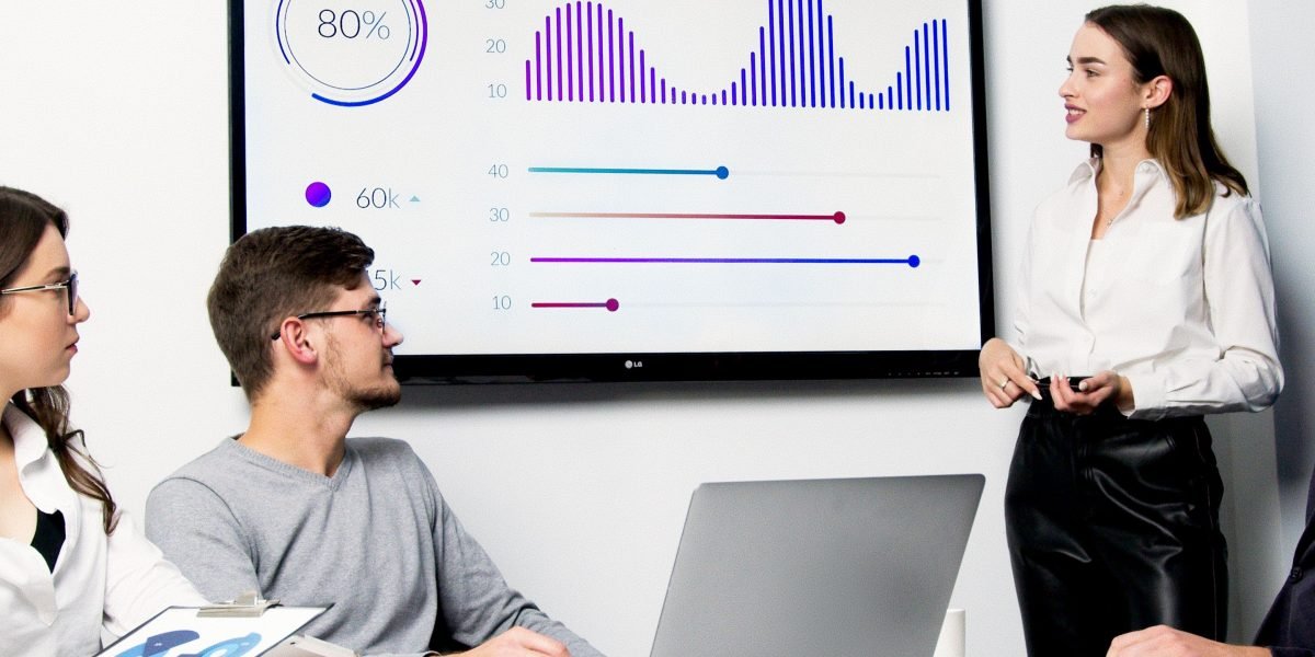 A team collaborates, analyzing complex data to build robust AI-driven investment models.