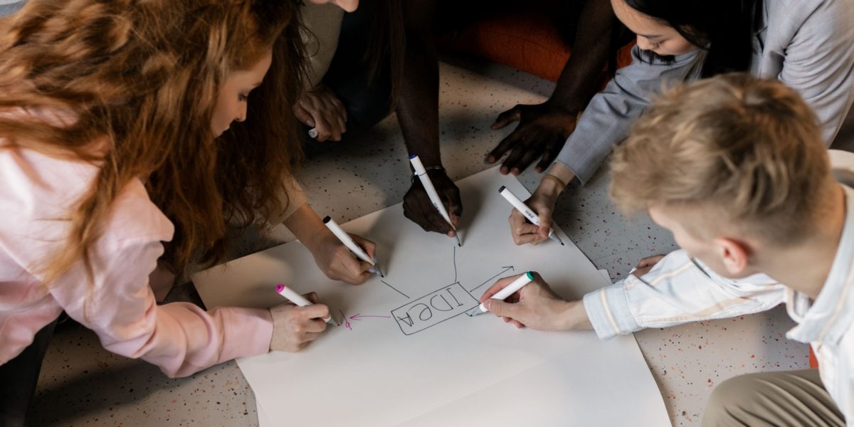A creative team brainstorms new ideas, empowered by the speed and flexibility of AI image generation.
