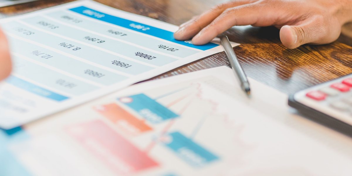 A professional reviewing performance metrics or creative outputs, showing satisfaction with the results.