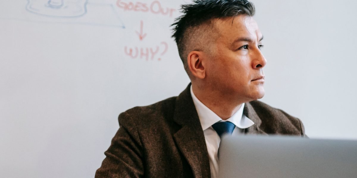 A marketing professional contemplating the vast landscape of new AI tools and information, seeking clarity and practical advice.