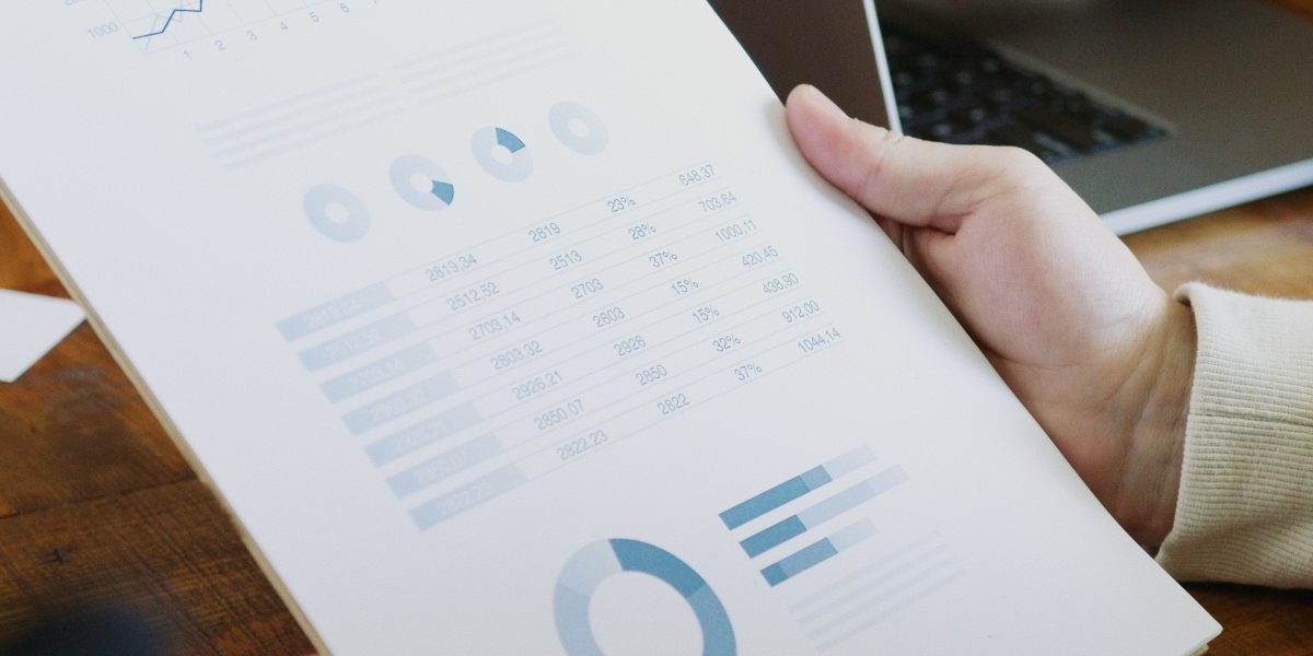 Marketing professionals reviewing complex analytics dashboards to understand the impact and effectiveness of their AI-driven campaigns.