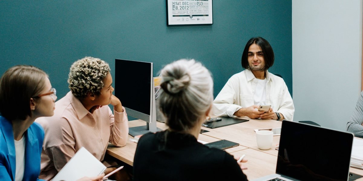 A business team in a meeting room, actively discussing and making strategic decisions.