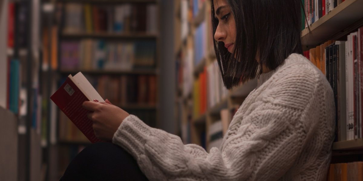A person engaged in learning, symbolizing the pursuit of knowledge in the fast-evolving field of AI.