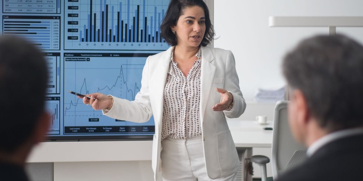 A professional confidently leading a discussion, symbolizing the career acceleration from mastering data skills.