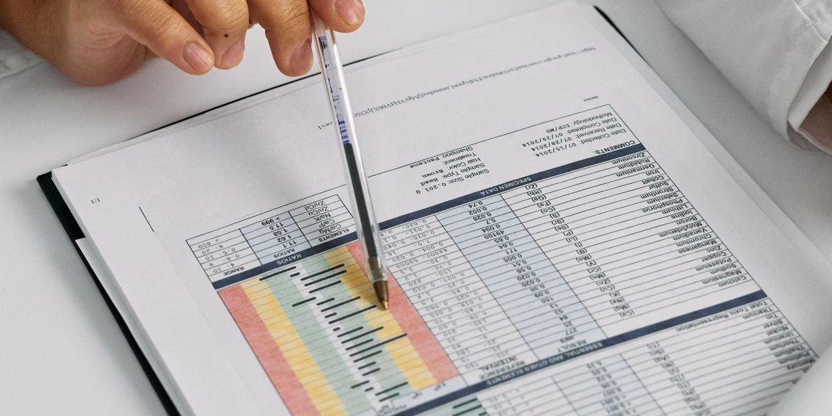 A person deeply focused while studying data visualizations, symbolizing the process of learning and mastering analytical tools.