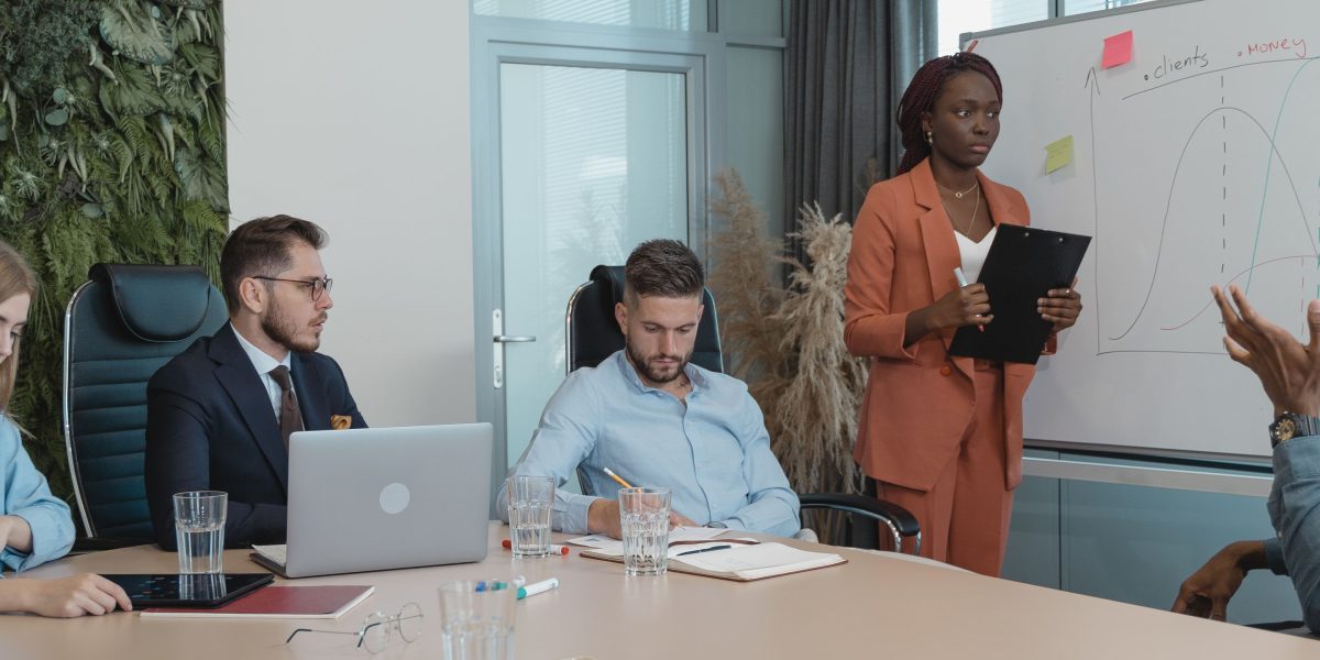 A diverse team discusses and strategizes on the optimal AI tool selection for their organization.