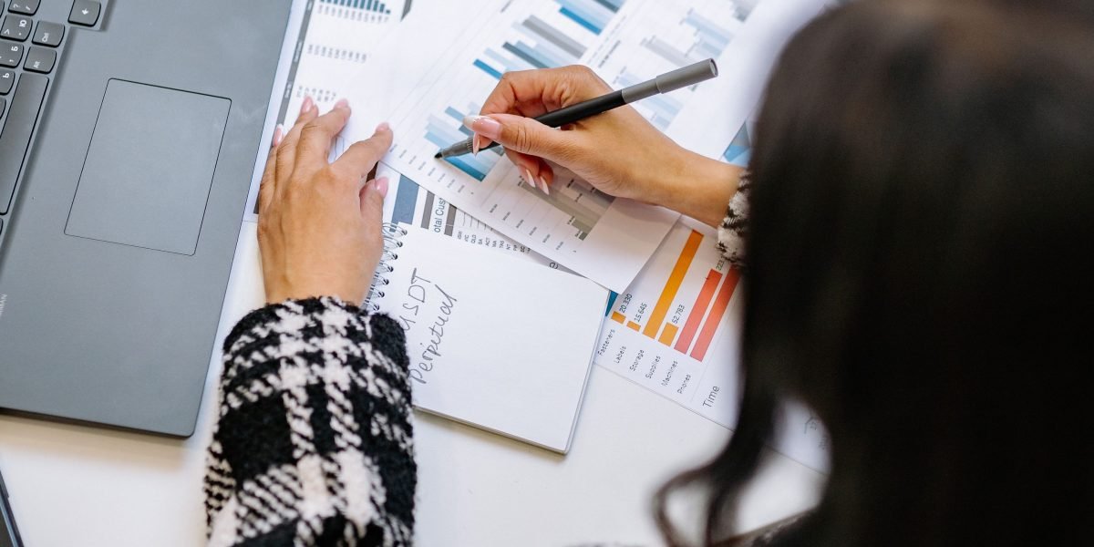 A professional meticulously examining data and reports to compare AI tool performances.