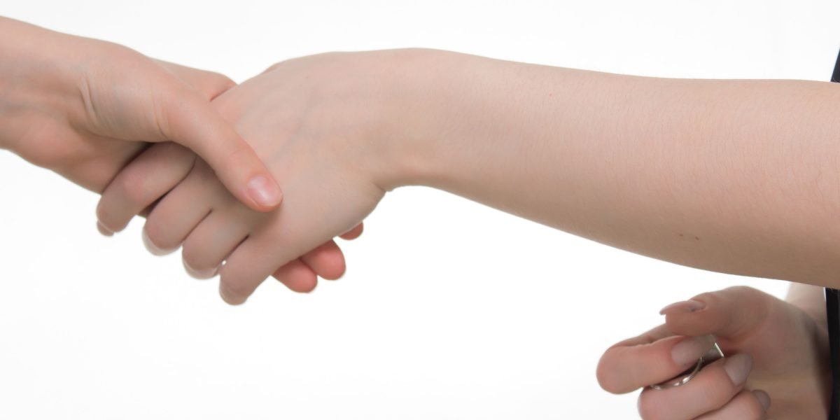 Professionals concluding a strategic agreement, symbolizing successful vendor selection or partnership.