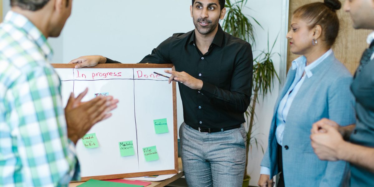 A team actively discussing and strategizing, reflecting the complex process of selecting the right AI models for business needs.
