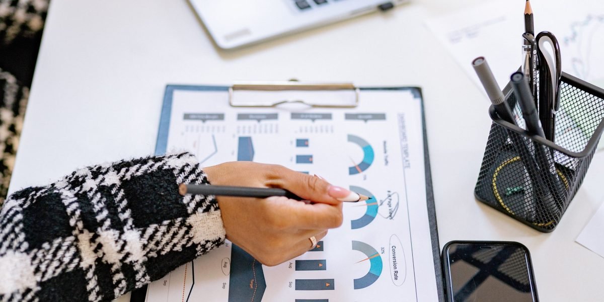 A professional reviewing performance charts, illustrating the crucial step of measuring impact and attribution for AI-driven campaigns.