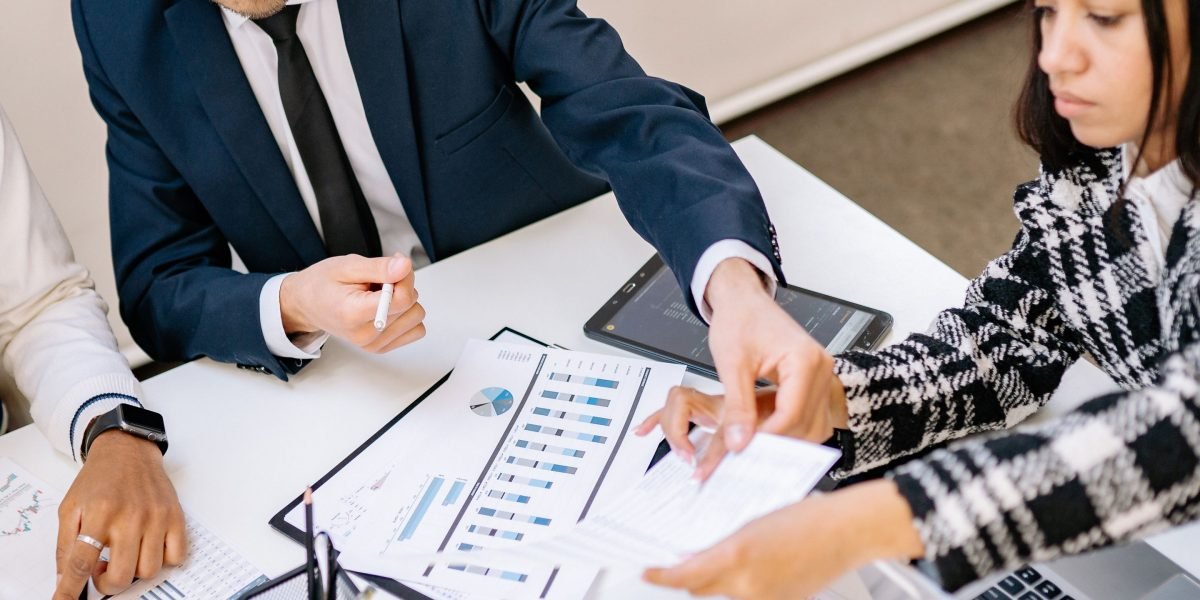 A team discussing critical data security measures and compliance requirements for AI projects in a B2B marketing agency setting.