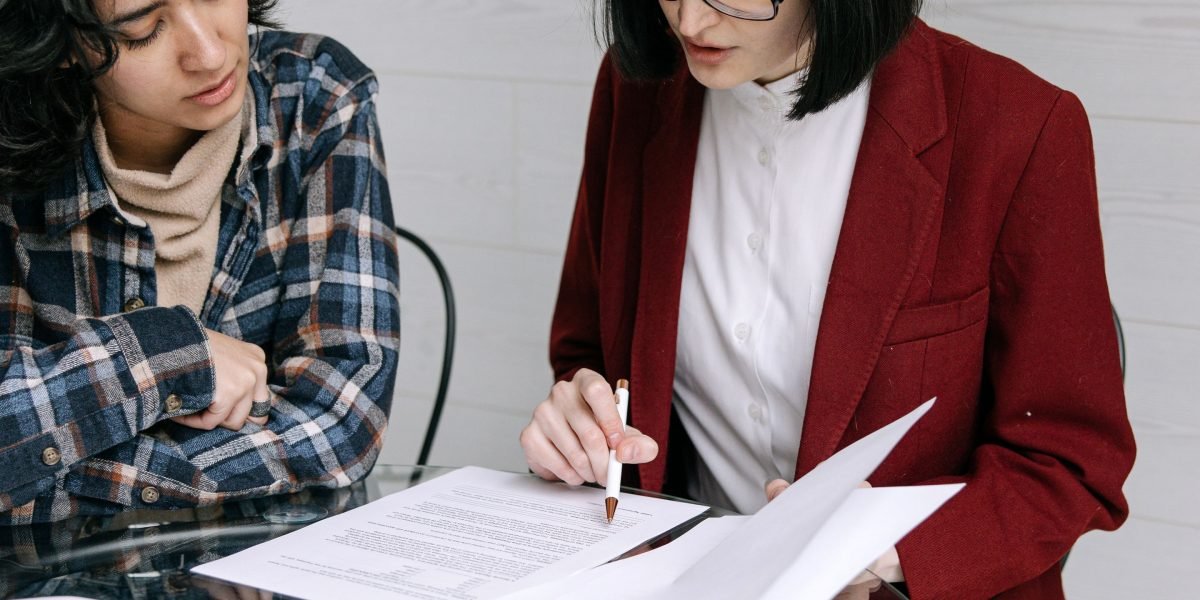 A person carefully reviewing a document, emphasizing the importance of understanding terms and conditions for AI tools.