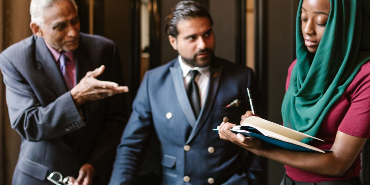 Business leaders confidently discussing strategic decisions in a modern office environment.