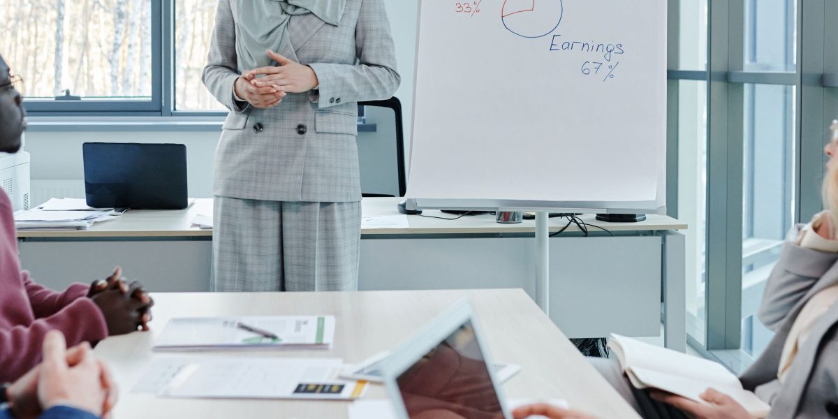A diverse team collaborating and discussing business strategy based on shared data insights.