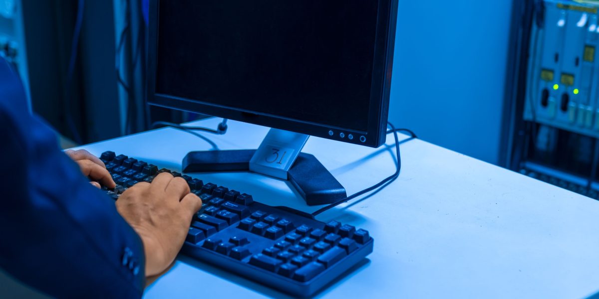An individual carefully monitoring a data system, emphasizing the importance of data quality and consistency.