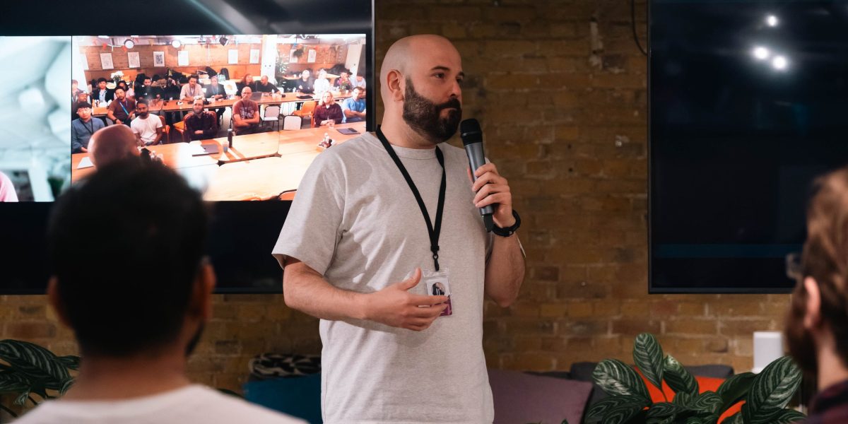 A person confidently presenting during a video call, showcasing strong communication skills vital for remote job interviews.