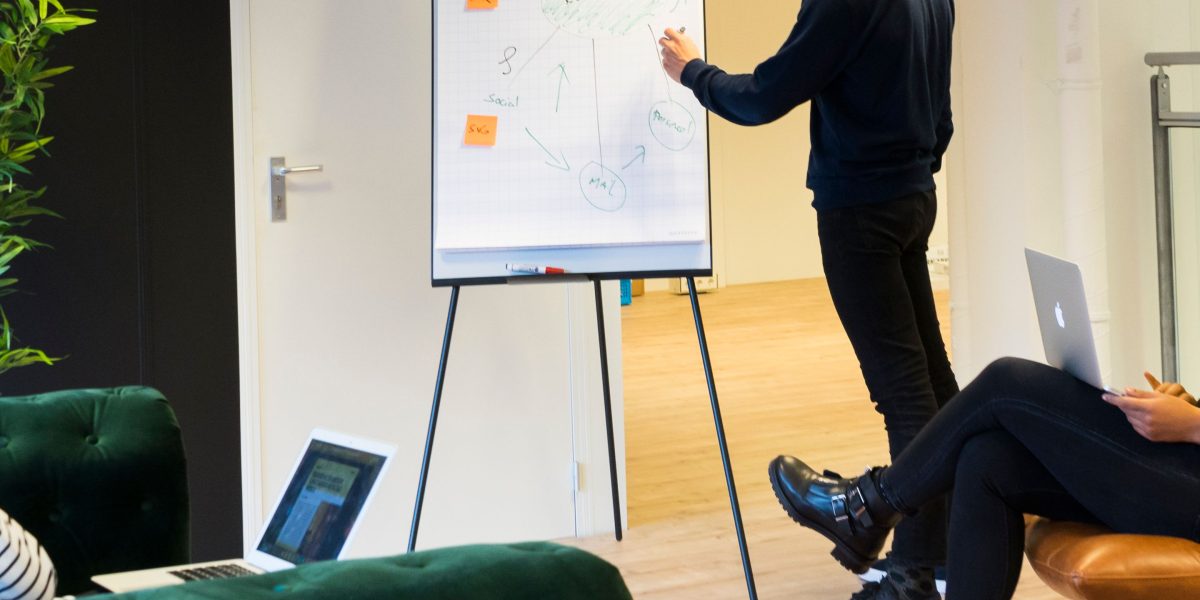 A diverse team collaborating, planning, and discussing strategies for job roles in an AI-driven market.