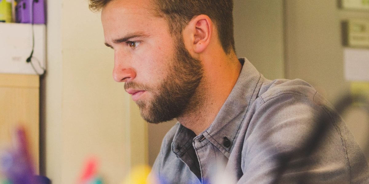 A creative professional focused on evaluating various options or candidates.