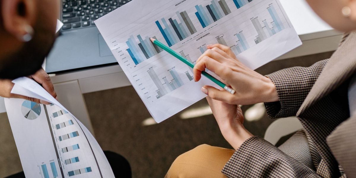 A business team reviewing performance metrics and campaign results together.