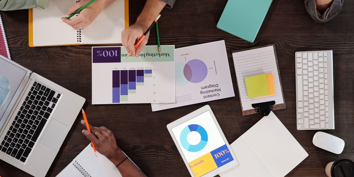 A diverse team of content creators brainstorms and collaborates on new marketing strategies.