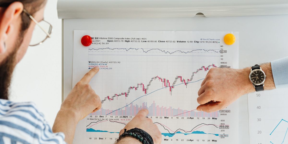 Marketing professionals reviewing data on a dashboard, illustrating the importance of measuring promotion success with analytics.