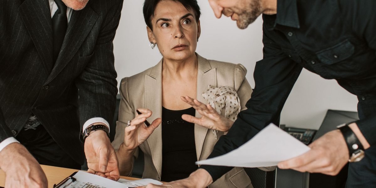 Two professionals engaged in a discussion, symbolizing a successful negotiation for salary or career terms.