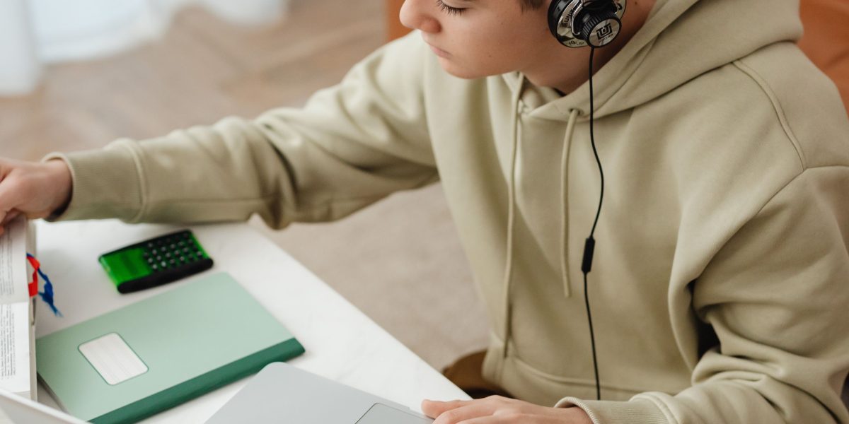 A person engaged in focused online learning, symbolizing the effort to master new data analytics skills.